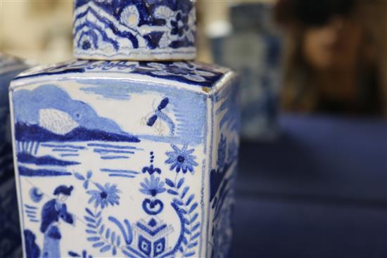 A pair of Dutch delft blue and white lidded tea caddies